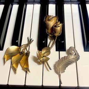 Three vintage brooches signed Giovanni
